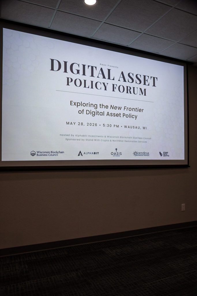 The forum's opening title slide projected on the screen: Digital Asset Policy Forum, Exploring the New Frontier of Digital Asset Policy.