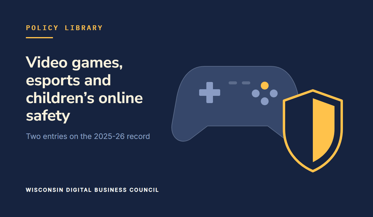 A game controller and a gold shield on navy.